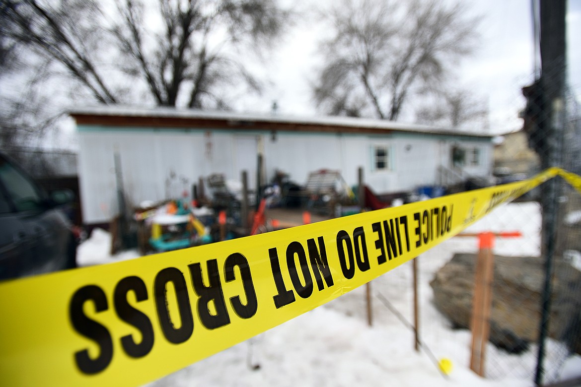 Police tape is shown outside a residence at 125 Flathead Drive on Tuesday, Jan. 18. (Casey Kreider/Daily Inter Lake)