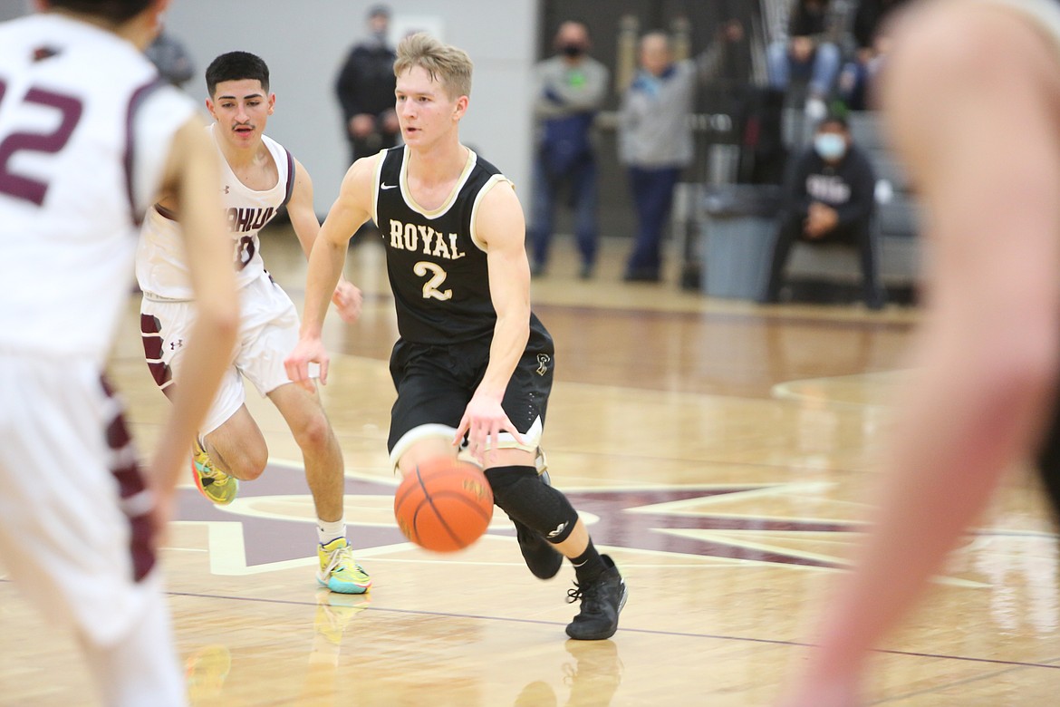 Luke Bergeson (2) of Royal High School drives the lane during the Friday game with Wahluke at Wahluke High School.