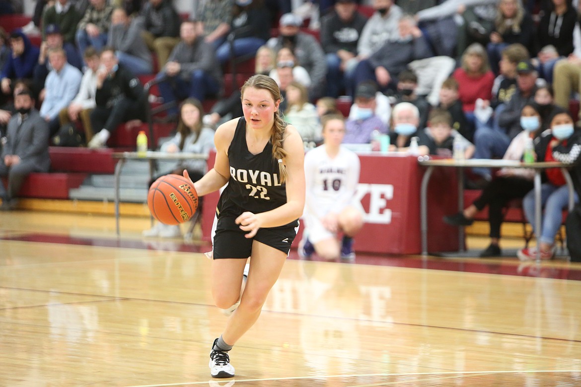 Kenia Orth (22) of Royal High School brings the ball up the court during the Friday game with Wahluke High School at WHS.