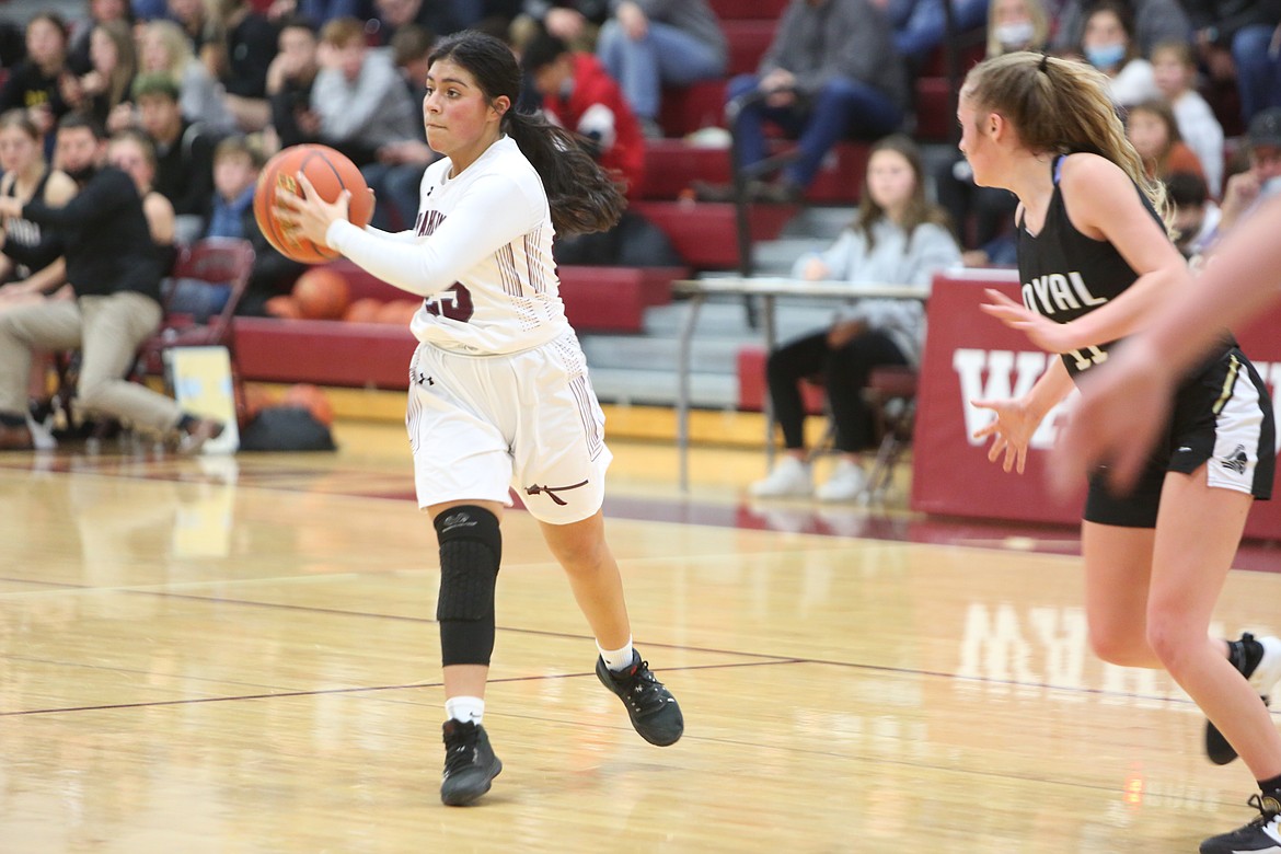 Salma Martinez (25) of Wahluke High School looks to pass during the game with Royal High School Friday at WHS.