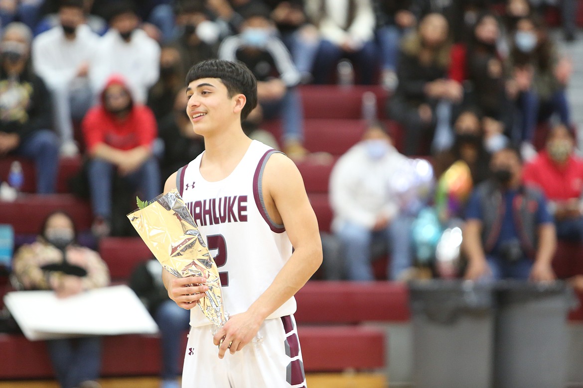 Arnoldo Ramos, of the Wahluke High School class of 2022, at half court on the basketball Senior Night on Friday.