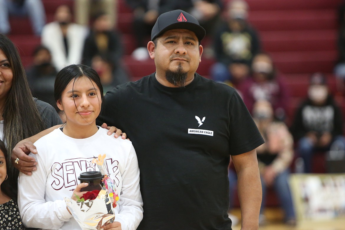 Abigail Nieves (left), a senior at Wahluke High School, stands with her dad Ray Nieves on basketball Senior Night on Friday.