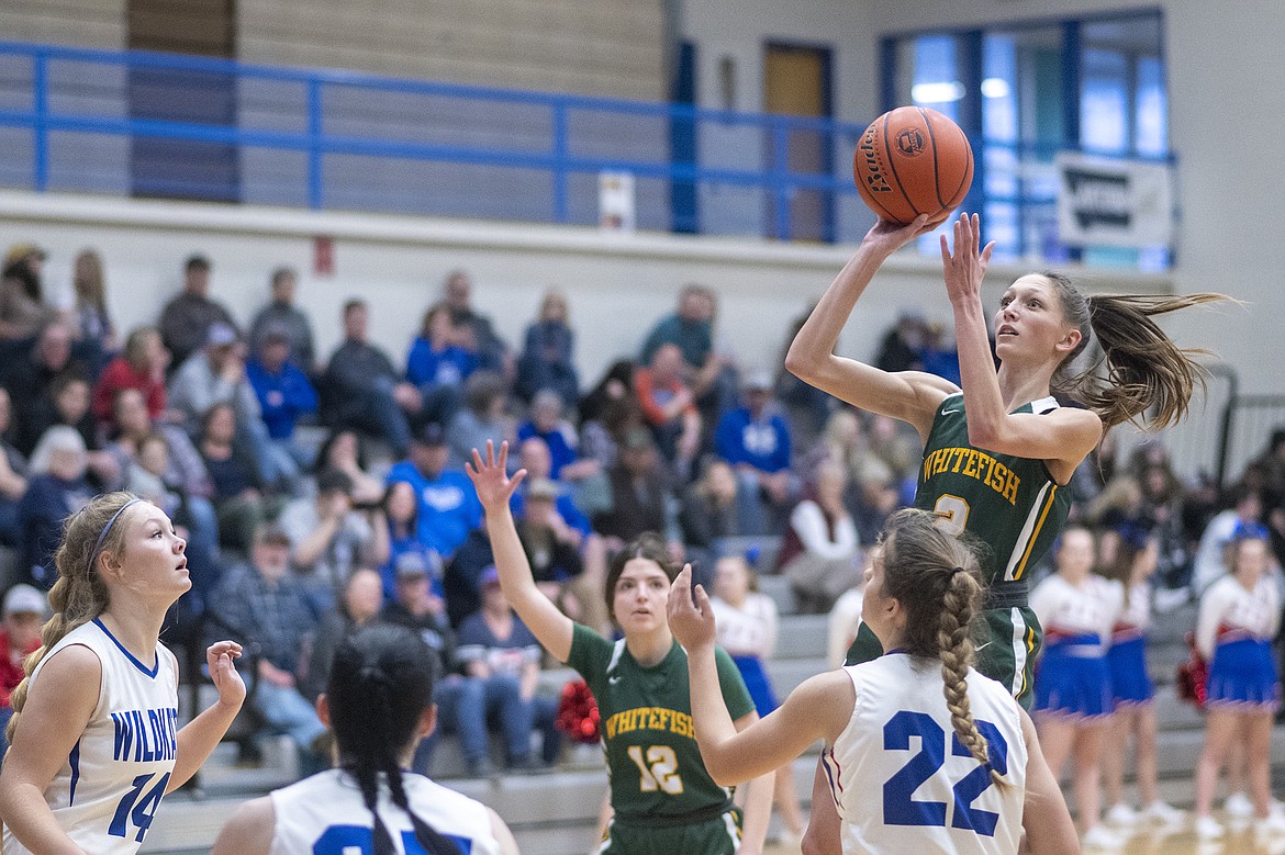 Lady Bulldog Erin Wilde tries a floater in the lane during a game against the Wildkats in Columbia Falls on Saturday. (Chris Peterson/Hungry Horse News)