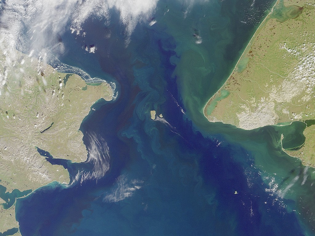 Satellite view of Bering Strait that once was a land bridge route connecting Siberia (on left) with Alaska for ancestors of Native Americans to migrate from Asia to America.