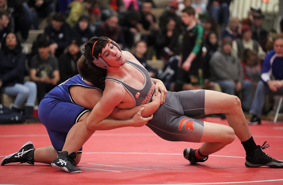 Landon Reynolds tries to escape during a match in the Blizzard JV Tournament at Sandpoint High earlier this season.