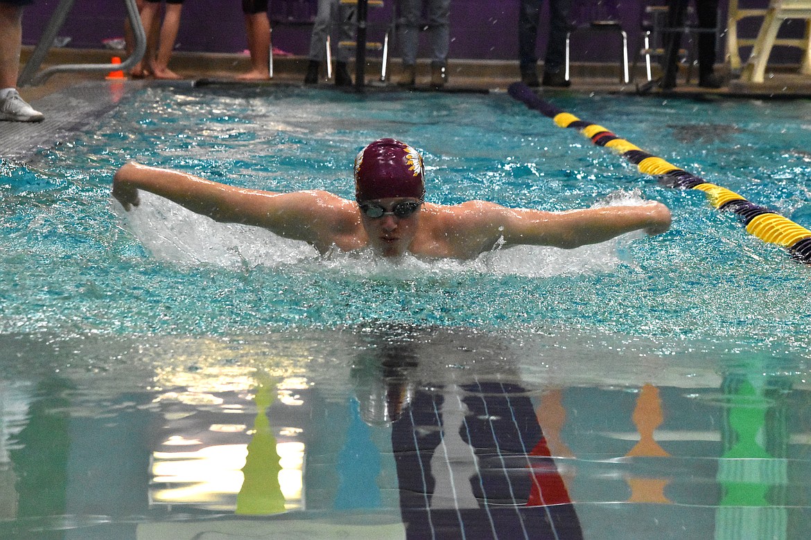 Moses Lake High School junior Ethan Puhlman swims in the 100-yard butterfly on Jan. 13 in Wenatchee.