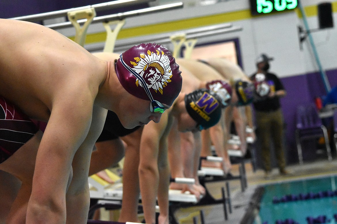 Moses Lake High School freshman Hunter Blackman is lined up, ready to dive in the water for his event at Wenatchee High School on Jan. 13.