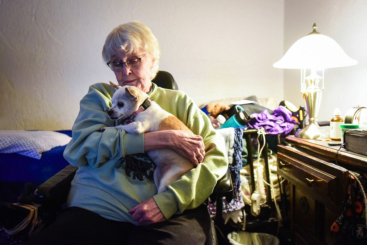 Alfreda Hamilton-Piland cradles her Chihuahua named Phoebe Grace inside her residence at the FairBridge Inn & Suites in Kalispell on Wednesday, Jan. 19. (Casey Kreider/Daily Inter Lake)