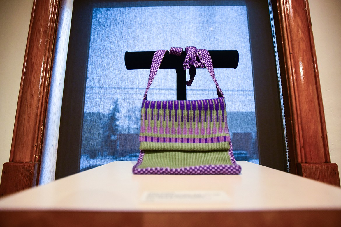 Artwork titled "Modern Day Possibles Bag: Just Add Face Mask & Hand Sanitizer," handwoven with wool and cotton yarns by Claire Darling at the Members' Salon 2022 exhibit at the Hockaday Museum of Art in Kalispell on Thursday, Jan 20. (Casey Kreider/Daily Inter Lake)