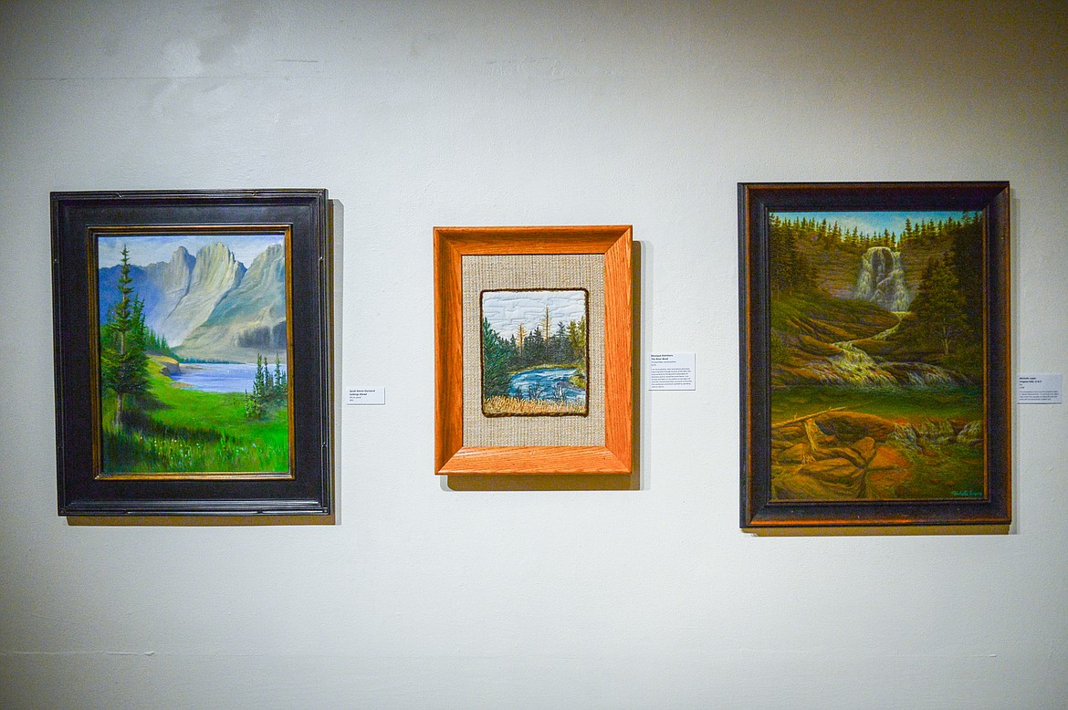 From left, "Icebergs Ahead" by Sarah Sherer-Oursland; "The River Bend" by Monique Kleinhans; and "Virginia Falls, G.N.P." by Michelle Lopez  at the Hockaday Museum of Art in Kalispell on Thursday, Jan 20. (Casey Kreider/Daily Inter Lake)