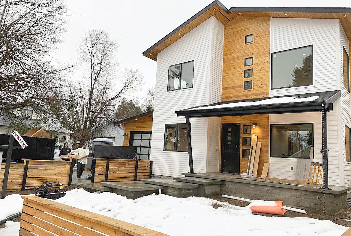 Rainy weather pushed workers inside at this home under construction at 21st and Mullan Avenue in Coeur d'Alene on Thursday.