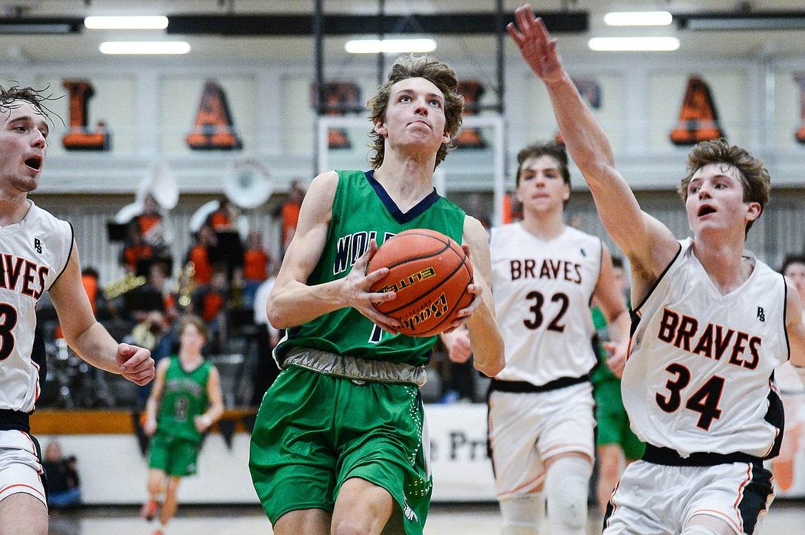 Glacier's John Pyron (1) drives to the basket against Flathead at Flathead High School on Friday, Jan. 21. (Casey Kreider/Daily Inter Lake)