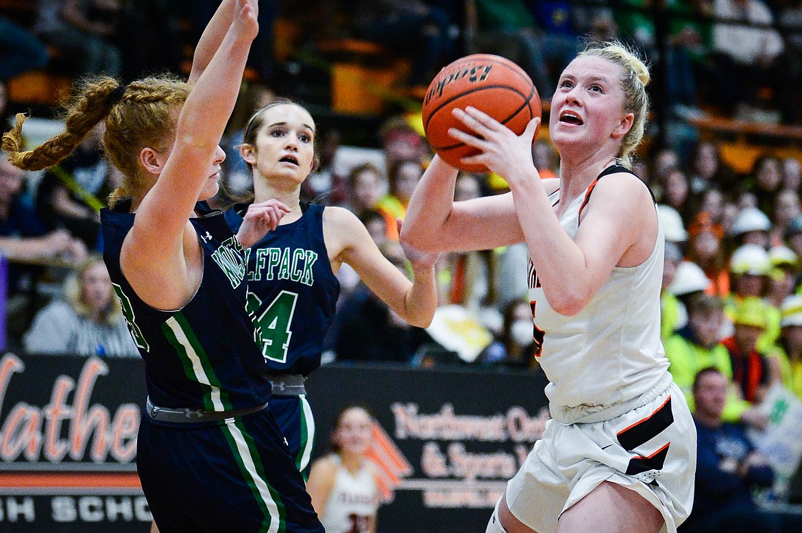 Flathead's Maddy Moy (5) drives into the lane for a bucket against Glacier at Flathead High School on Friday, Jan. 21. (Casey Kreider/Daily Inter Lake)