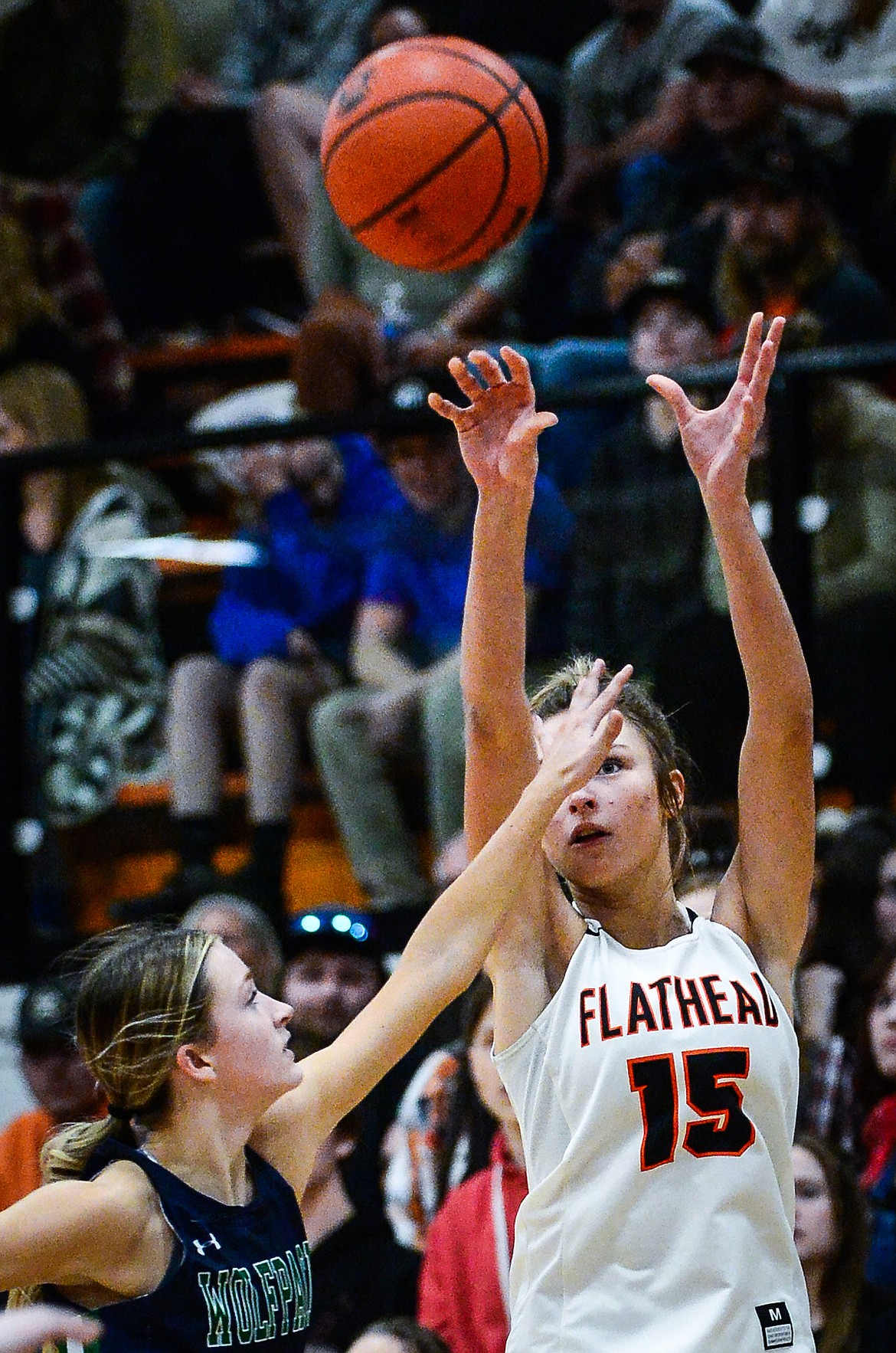 Flathead's Clare Converse (15) shoots a three-pointer guarded by Glacier's Kiera Sullivan (5) at Flathead High School on Friday, Jan. 21. (Casey Kreider/Daily Inter Lake)