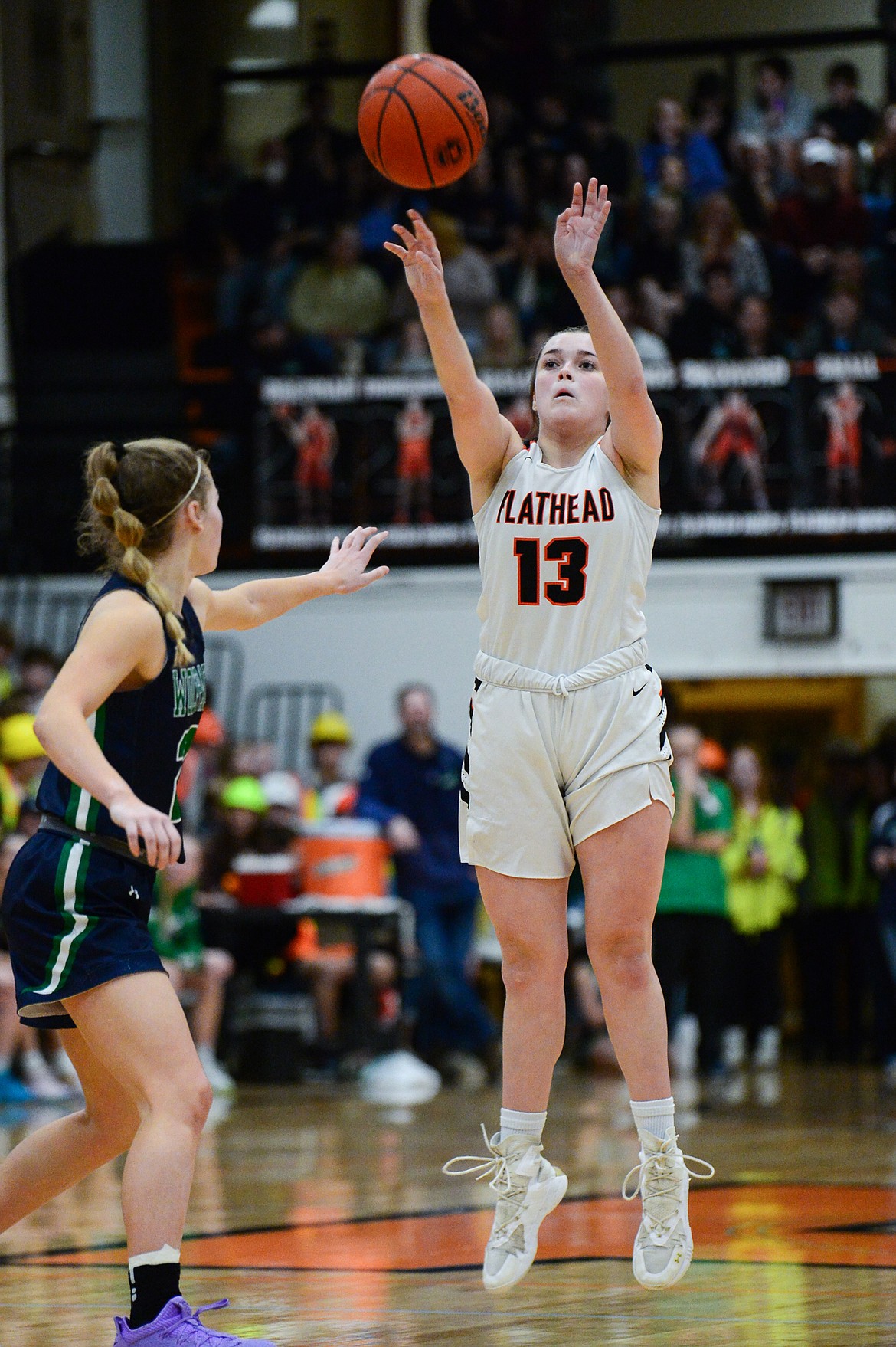 Flathead's Avery Chouinard (13) knocks down a three-pointer against Glacier at Flathead High School on Friday, Jan. 21. (Casey Kreider/Daily Inter Lake)