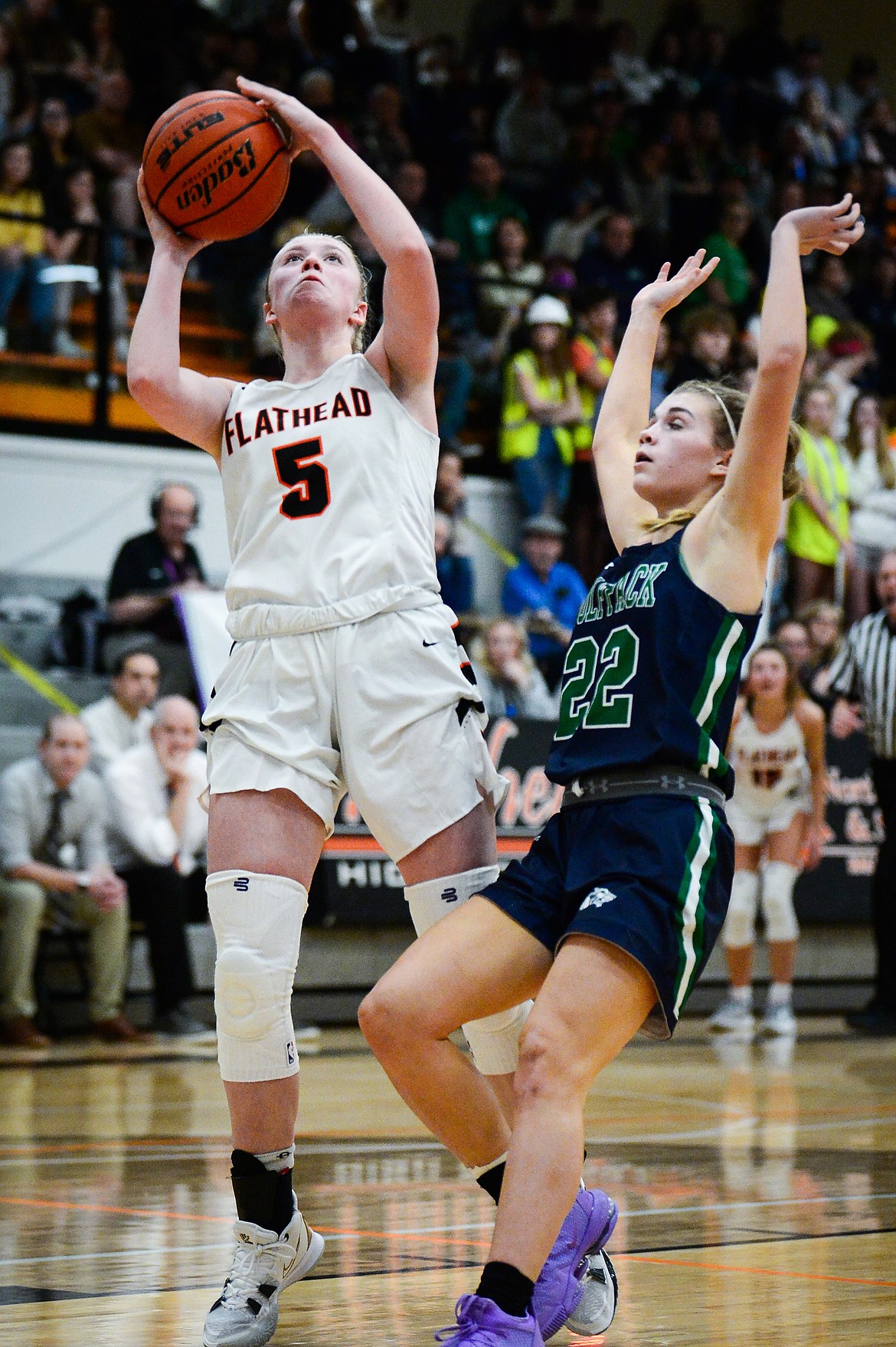 Flathead's Maddy Moy (5) drives to the basket against Glacier's Noah Fincher (22) at Flathead High School on Friday, Jan. 21. (Casey Kreider/Daily Inter Lake)