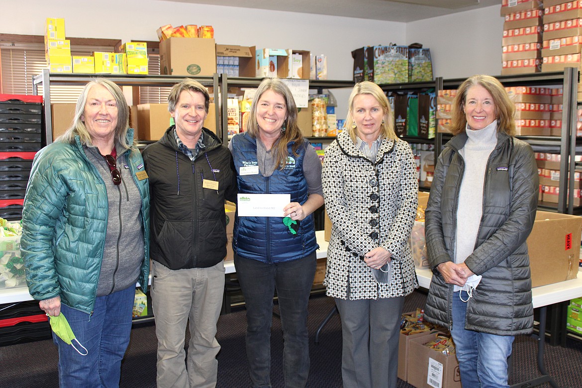 Whitefish Community Foundation presented a $25,000 grant to Land to Hand on Jan. 19 to support the relocation of the organization’s building to a new site adjacent to the Wildcat Garden at Columbia Falls Junior High School. From left to right are Carol Atkinson, Doug Reed, Gretchen Boyer, Linda Engh-Grady and Betsy Bayne. (Courtesy photo)