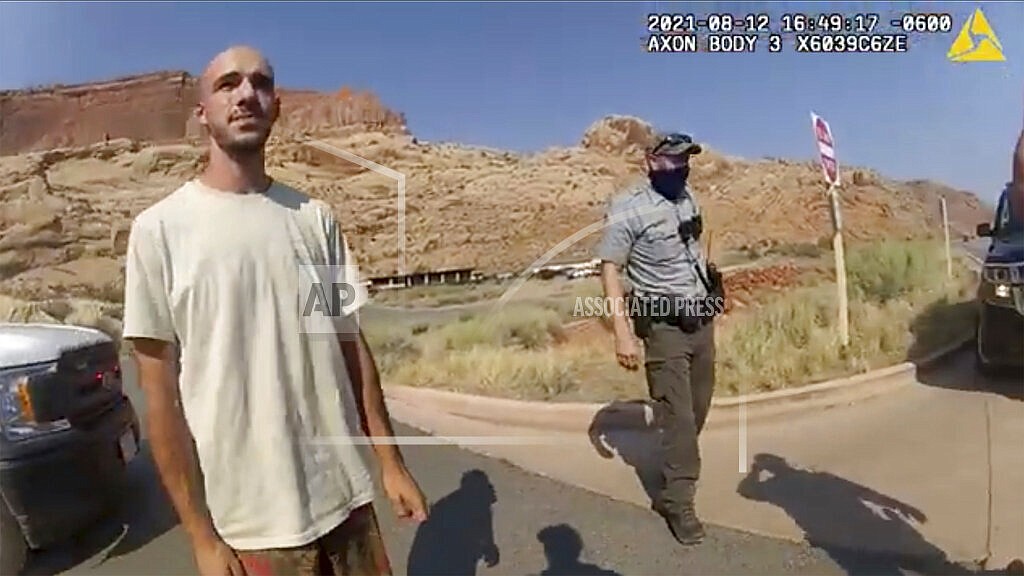 This Aug. 12, 2021, file photo from video provided by the Moab, Utah, Police Department shows Brian Laundrie talking to a police officer after police pulled over the van he was traveling in with his girlfriend, Gabrielle "Gabby" Petito, near the entrance to Arches National Park in Utah. Laundrie, the boyfriend of slain cross-country traveler Gabby Petito, took responsibility for killing her in a notebook discovered near his body in a Florida swamp, the FBI announced Friday, Jan. 21, 2022. (The Moab Police Department via AP, File)