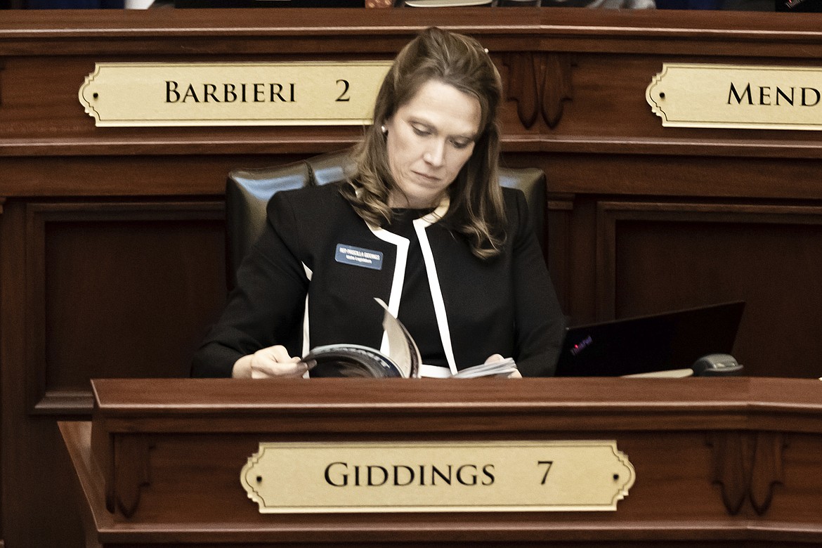 Idaho Rep. Priscilla Giddings, R-White Bird, sits at her desk inside the house chambers at the state Capitol building, Monday, Jan. 10, 2022 in Boise, Idaho. Giddings is being sued under the state's public records act for publicizing the name of a 19-year-old intern who reported that she was raped, The lawsuit, filed earlier this month by Erika Birch, the attorney representing the intern, contends that Giddings didn't comply with the state law when she denied access to several documents related to the ethics investigation without citing a valid exemption for denying the request. behavior.