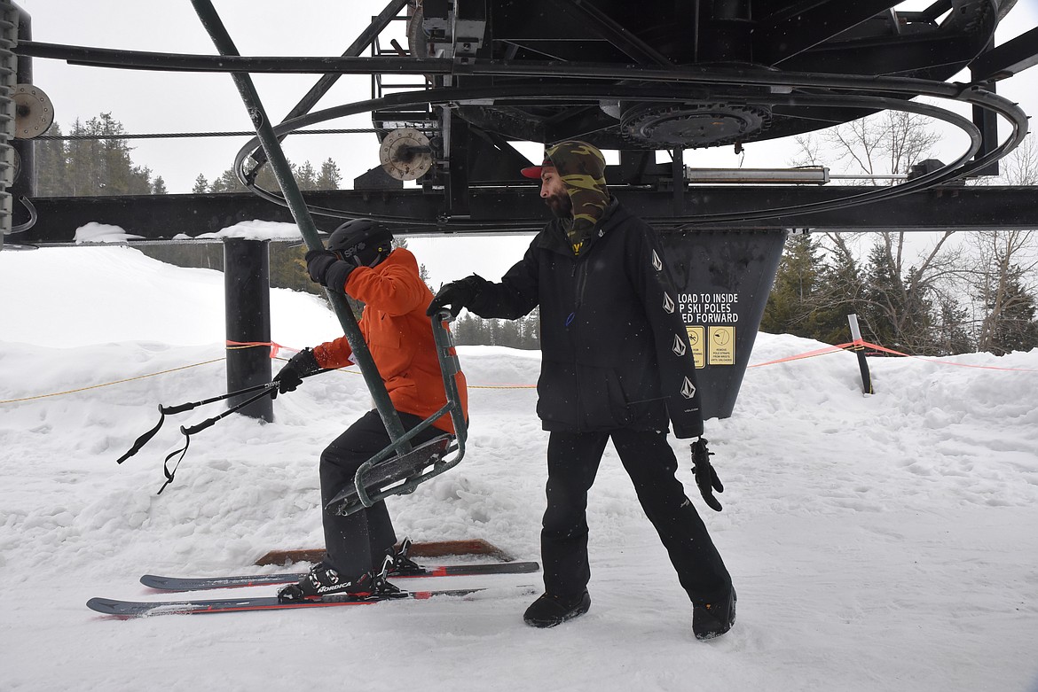 Skiers get on the chairlift at Turner Mountain Ski Area. (Derrick Perkins/The Western News)