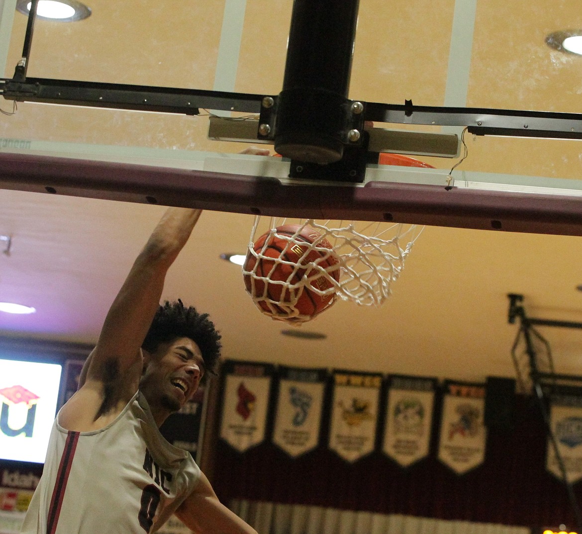 JASON ELLIOTT/Press
North Idaho College sophomore forward Julius Mims dunks during the first half of Saturday's game at Rolly Williams Court.