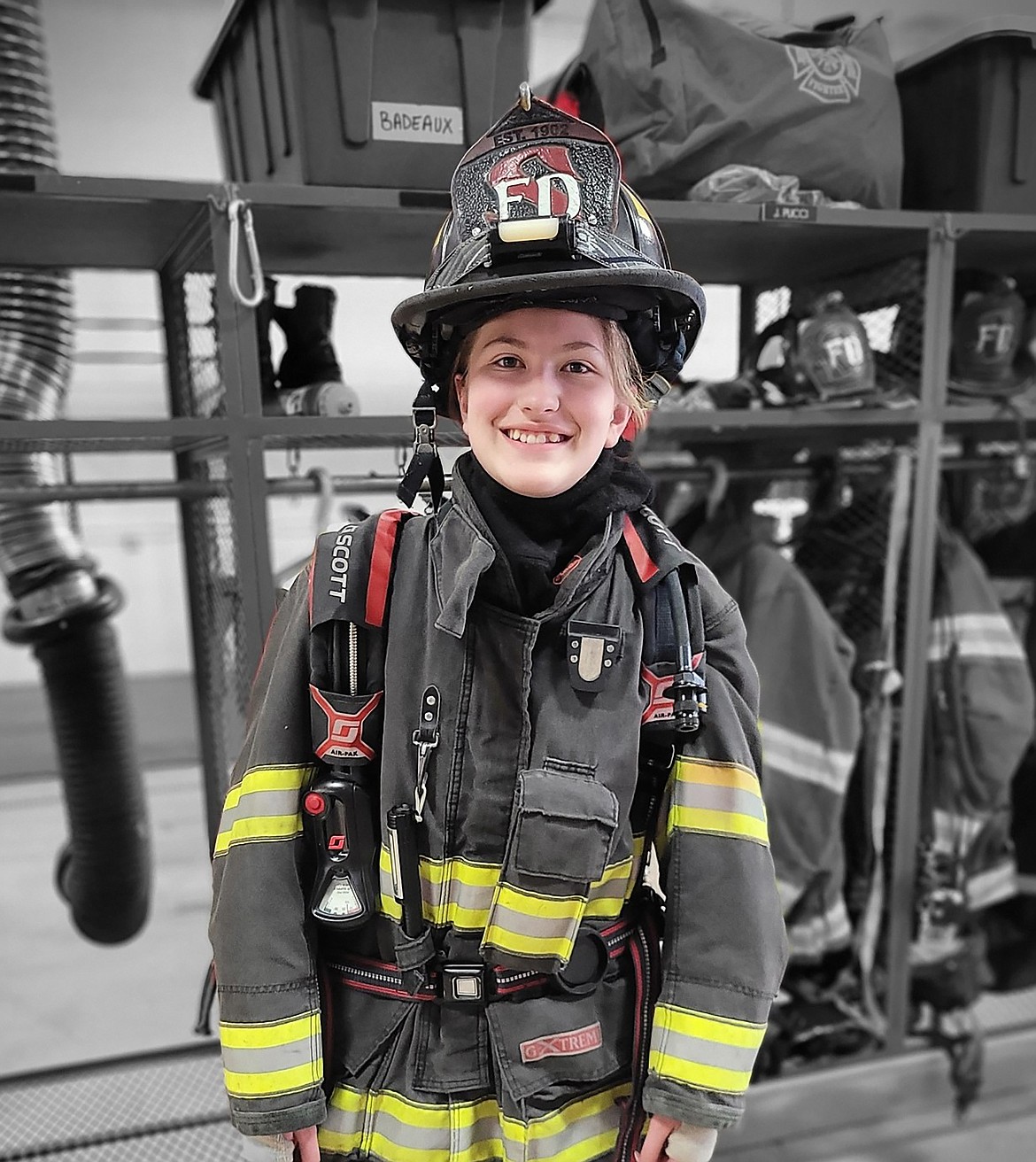 A teen tries on firefighting gear during a recent visit to the Selkirk Fire station by Sandpoint Teen Center participants.
