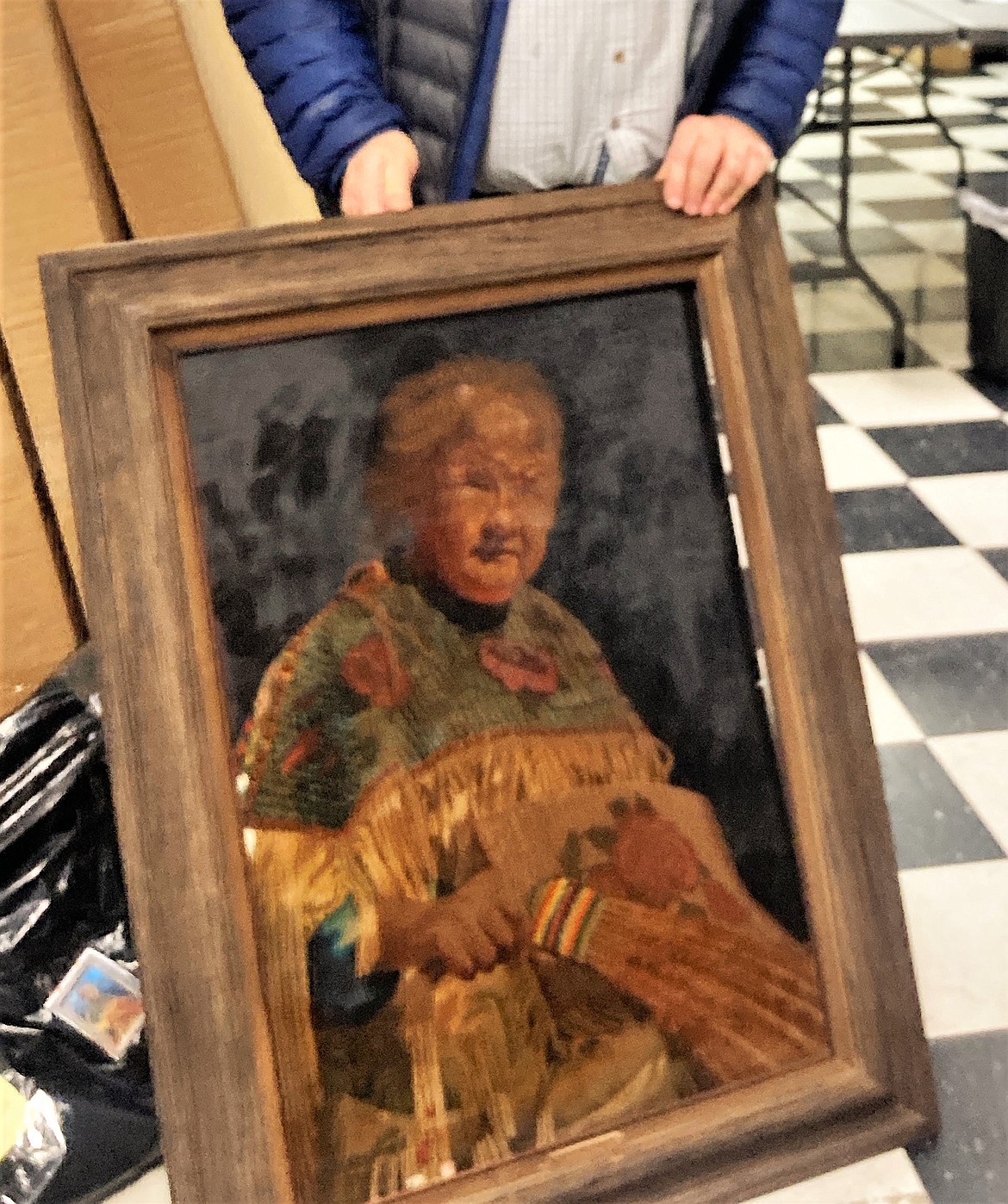 The significant soot and heat damage made it impossible to clean this portrait of Agnes Kenmille, which will still hang in the Three Chiefs museum. (Carolyn Hidy/Lake County Leader)