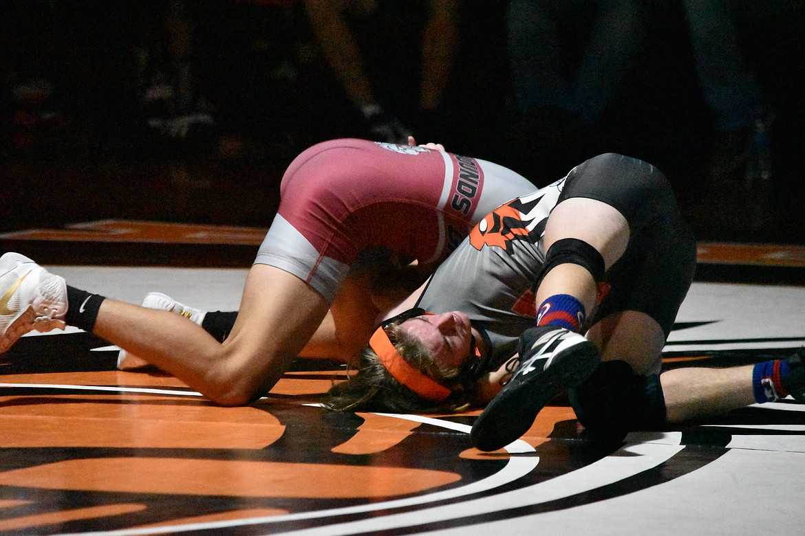 Ephrata High School freshman Keyton Lawter is put into an awkward position by his Grandview High School opponent on Thursday.