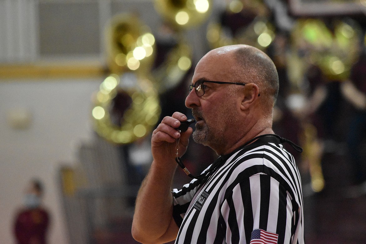 Scott Strom prepares to blow his whistle at the Moses Lake High School versus Sunnyside High School basketball game on Saturday.