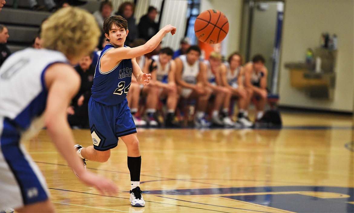 Zoran LaFrombois fires off a pass at Bigfork. (Scot Heisel/Lake County Leader)