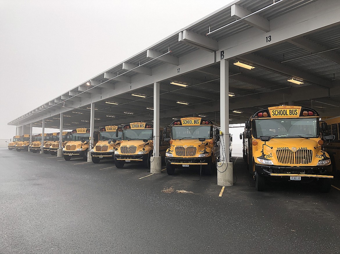 Buses sit at the Moses Lake School District Transportation Department in 2021.