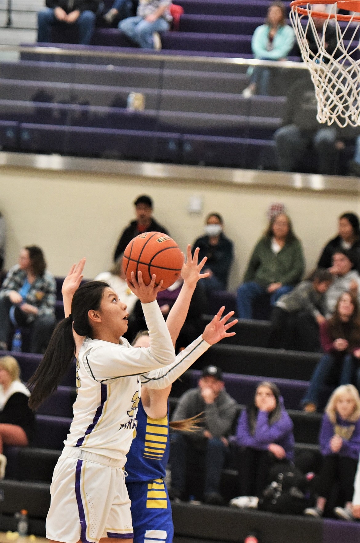 Turquoise Pierre goes up for a shot against Libby. (Scot Heisel/Lake County Leader)