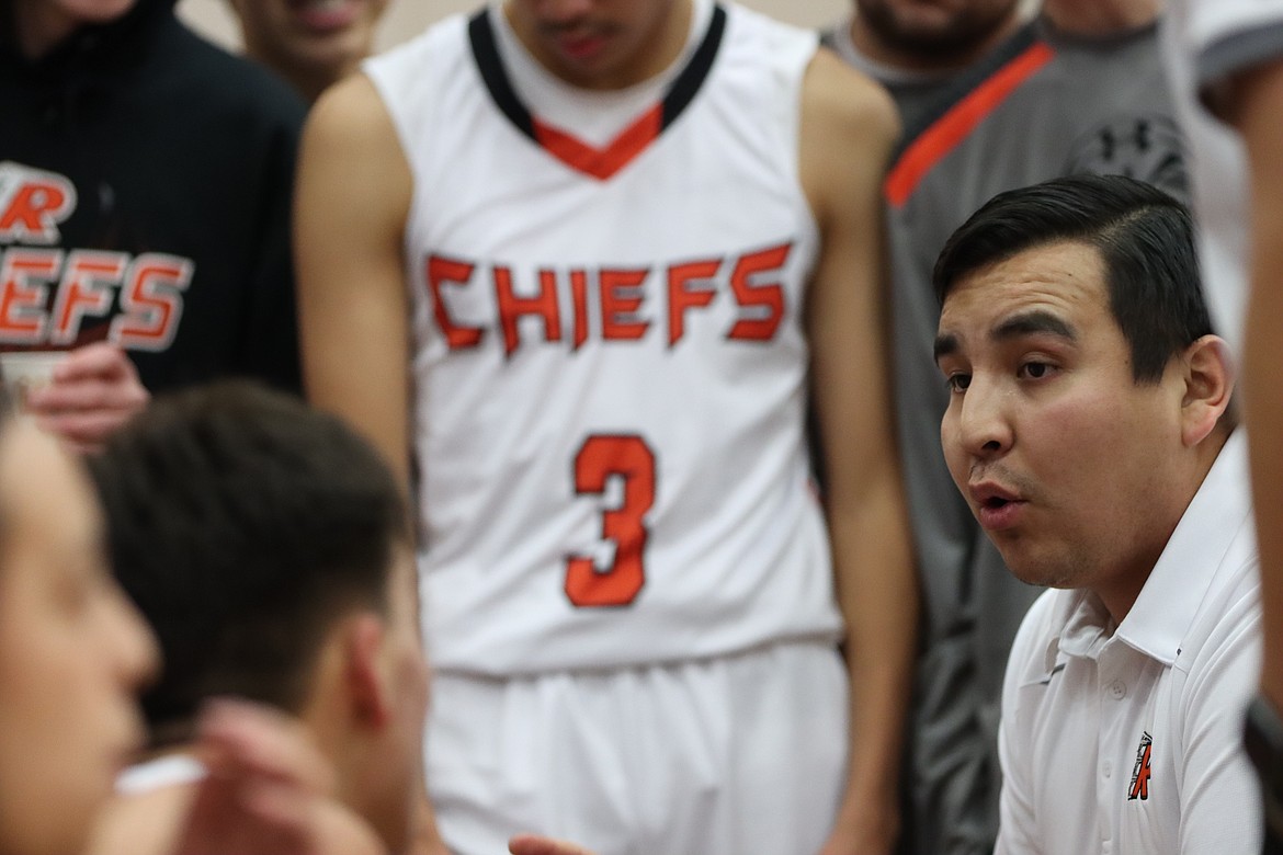 Ronan coach DJ Fish talks with his team during a timeout. (Courtesy of Niki Graham)