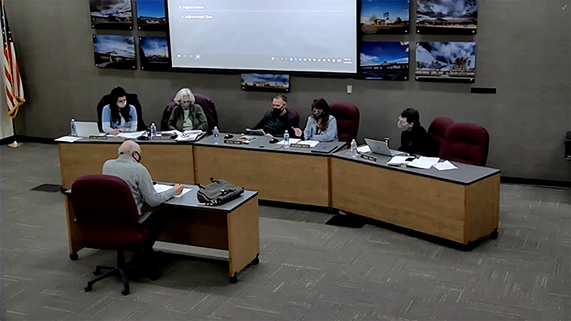 Bill Jordan of Northwest Leadership Associates (with back to camera) discusses the hiring process with the Moses Lake School District Board of Directors Thursday night. The district has been under the direction of interim superintendent Carole Meyer since former superintendent Josh Meek left the district in August.