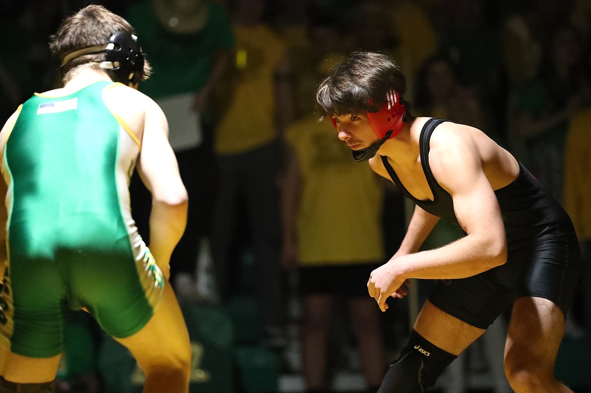 Adam Belgarde (right) competes in Friday's dual at Lakeland.