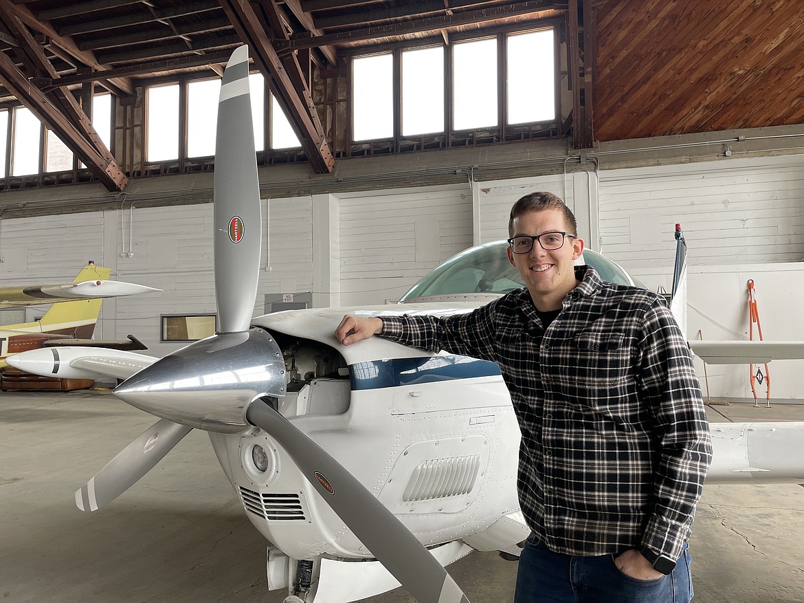 Josiah Barrett, owner of Barrett Aircraft, stands with a plane in one of the giant, World War II-era hangars at the Ephrata Municipal Airport. Barrett rented the cavernous, wooden hangar for his airplane repair business, which will formally open its doors on Feb. 7.