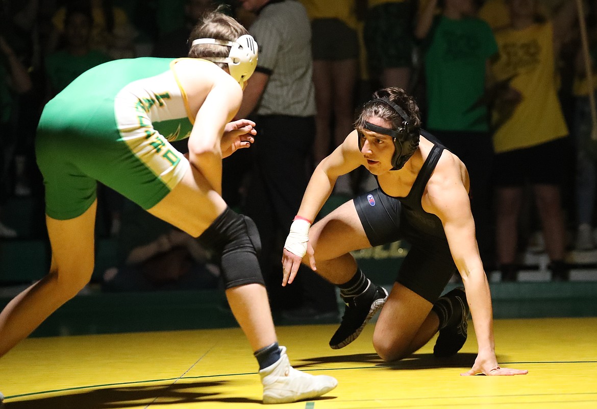 Christian Troumbley-Karkoski (right) looks to make a move in his match Friday.