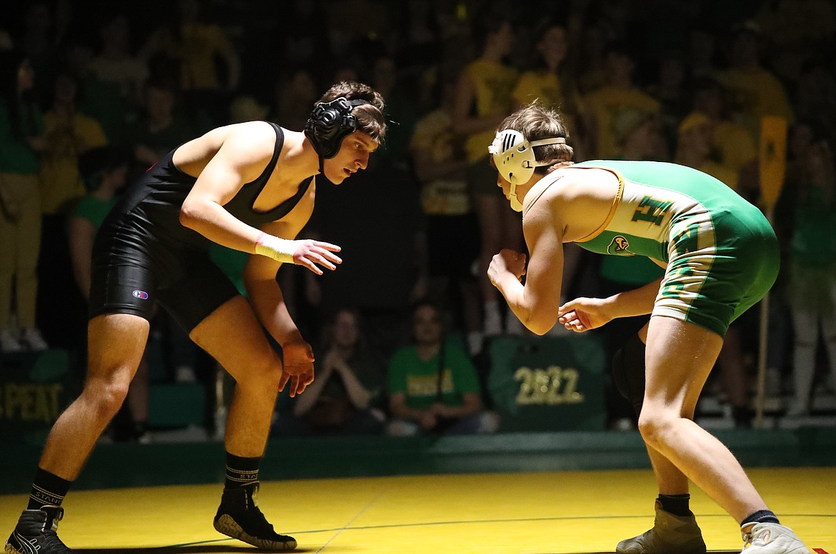 Christian Troumbley-Karkoski (left) faces off with his opponent Friday.