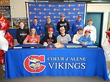 Signing photos Feb. 12, 2022