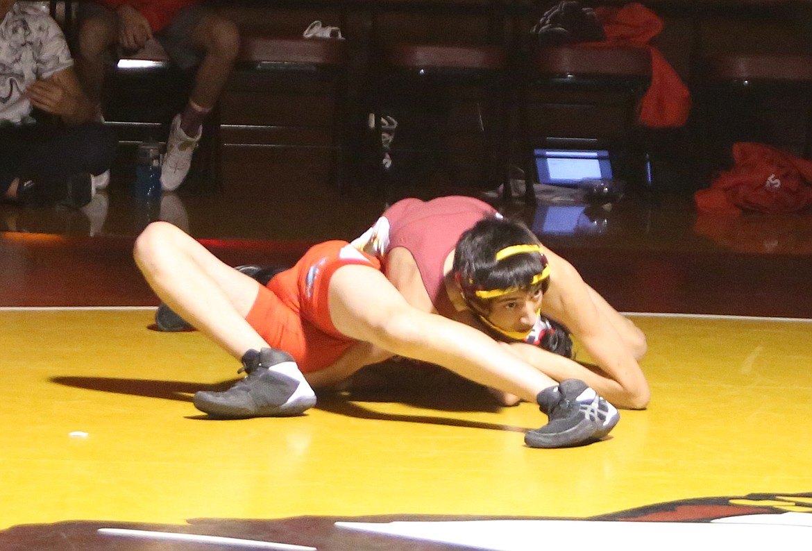 Moses Lake High School wrestler Stephen Jackson takes down Izek Perez Rodriguez in Friday’s dual against Eastmont High School.