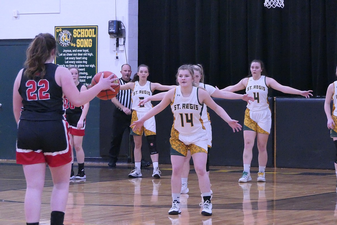 Brooke Jackson (22) looks for a way around the St. Regis defense during the game Tuesday night in St. Regis.  (Chuck Bandel/MI-VP)