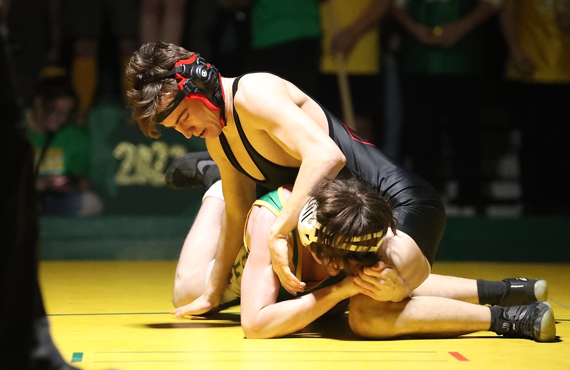 Wyatt Marker (top) takes control during his 132-pound match Friday.