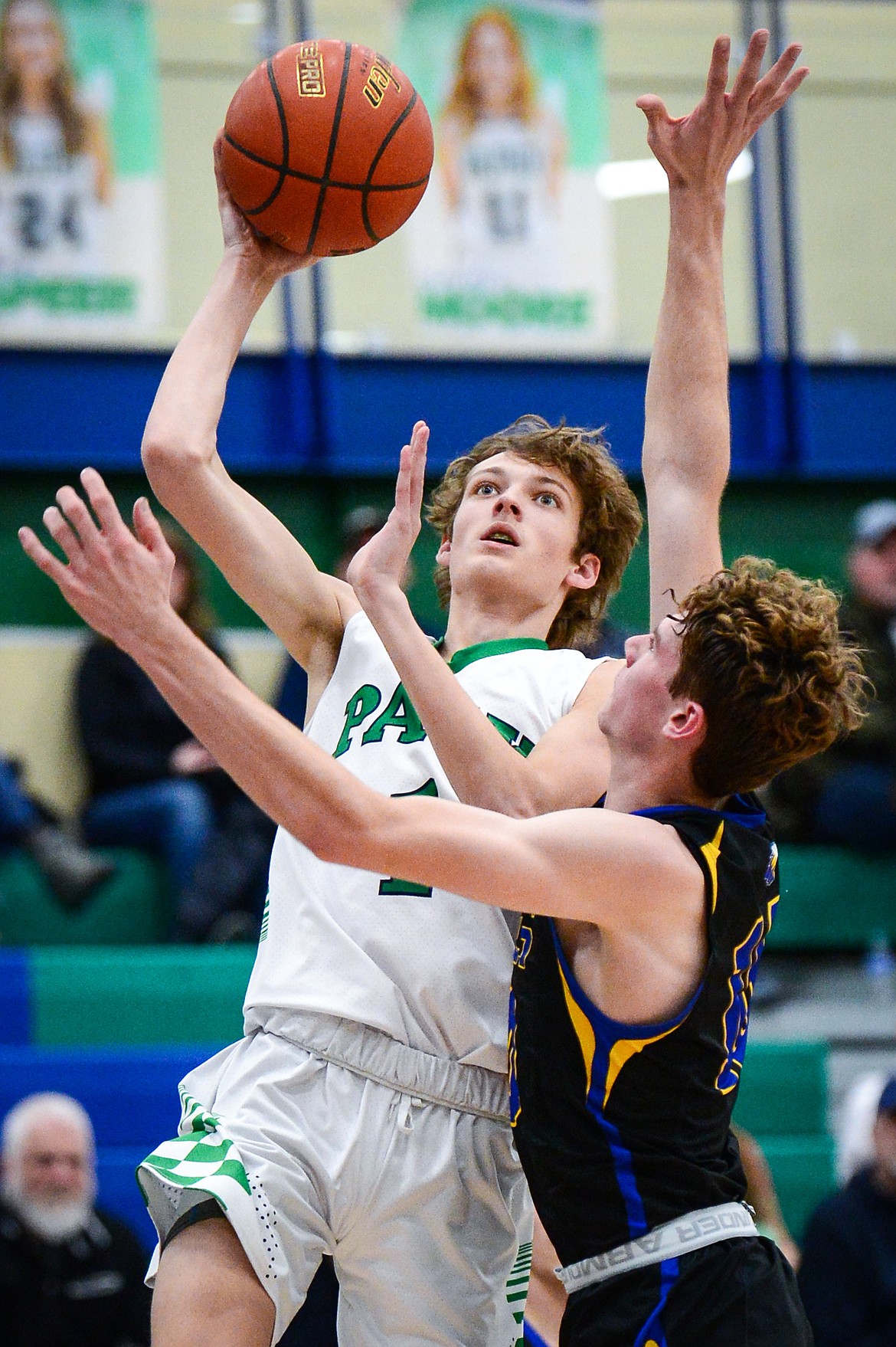 Glacier's John Pyron (1) draws a foul on Missoula Big Sky's Caden Bateman (10) on his way to the basket at Glacier High School on Tuesday, Jan. 25. (Casey Kreider/Daily Inter Lake)