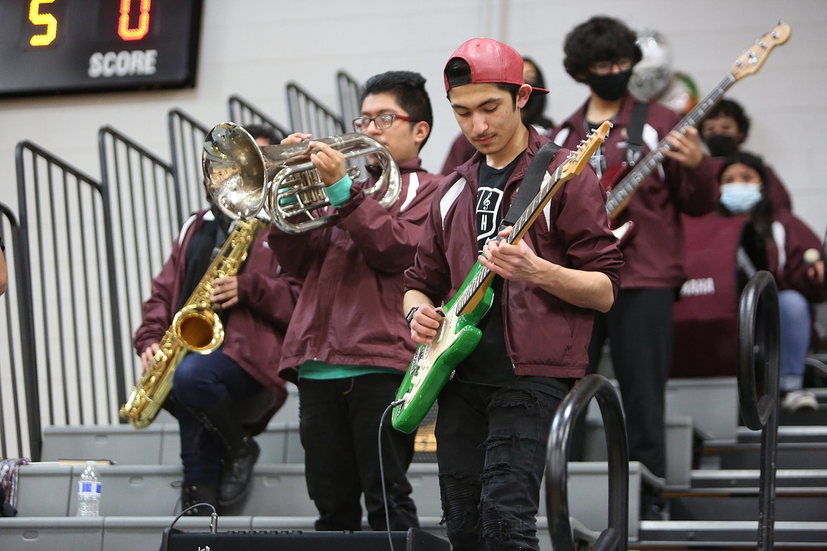 Wahluke High School pep band members Noel Virgen, left, and Richie Torres, right, play during a WHS basketball game Jan. 14.