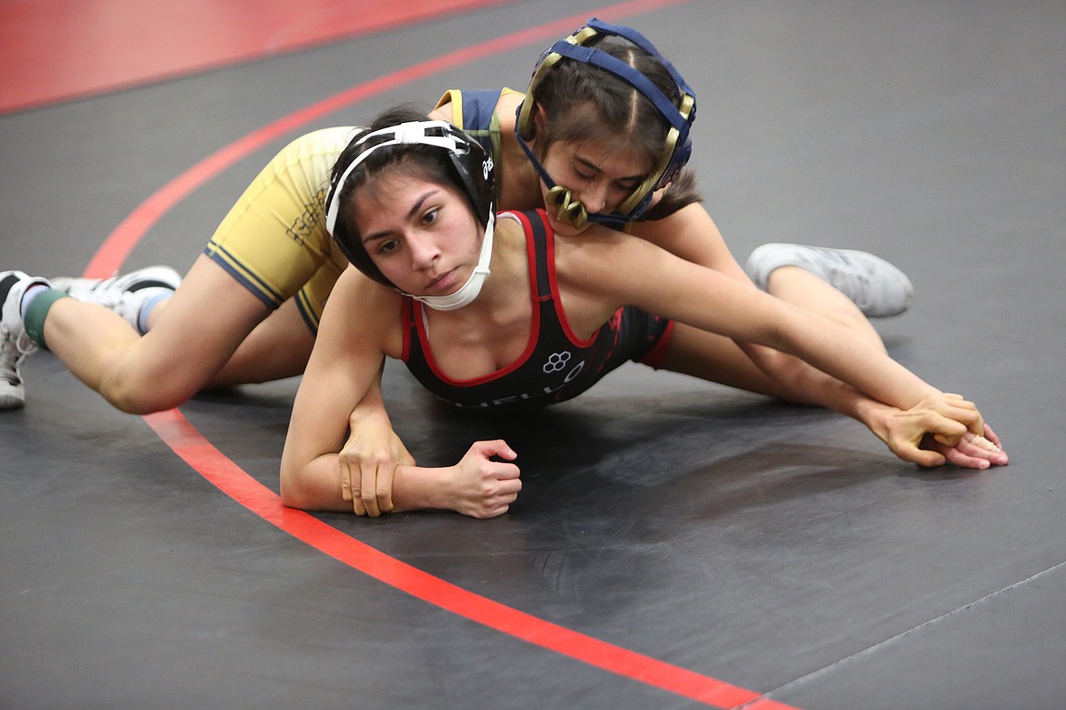 Aliyah Espinosa, of Othello High School, tries to escape Diana Camargo, of Wapato High School, during the Lady Huskies invitational wrestling tournament on Friday.