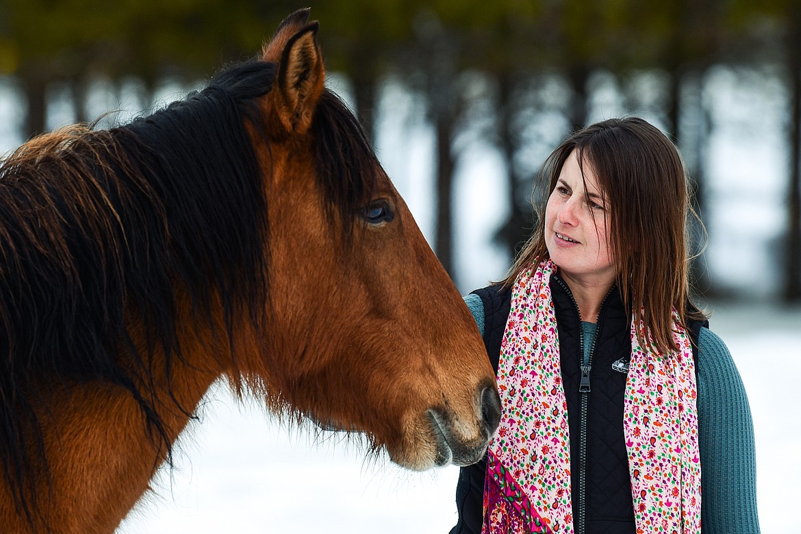 Katie Rose with her horse Annie at Come Alive Healing Adventures on Friday, Jan. 21. (Casey Kreider/Daily Inter Lake)