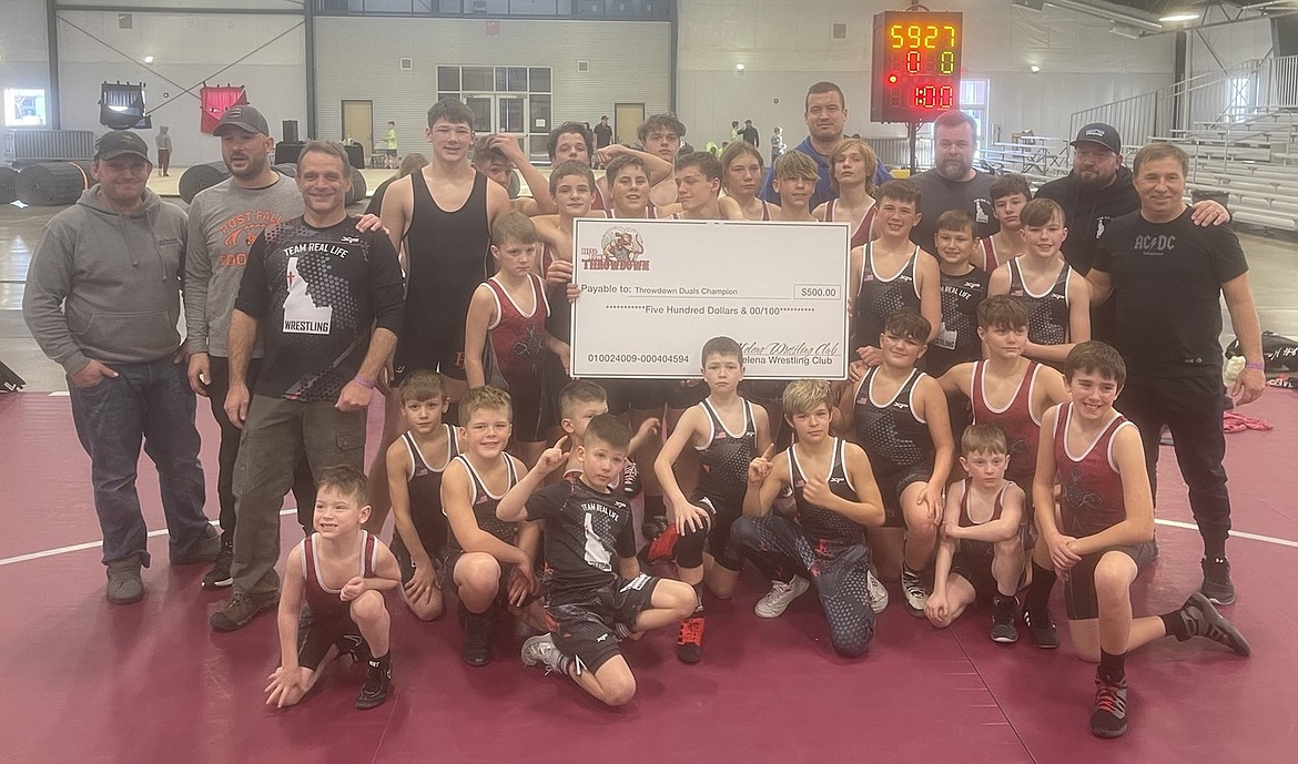 Courtesy photo
Team Real Life took first place at the Helltown Duals in Helena, Mont., on Jan. 9. In the front row from left are Zavior McKay, Jimmer Genatone, Tristan Mendenhall, Lex Sheffler and Beaudi Shaeffer; second row from left, Rowen Moore, Knox Kjar, LJ McKay, Ramon Brown, Matthew Hamilton and Hudson Ott; third row from left, Matthew Hamilton, Nick Genatone, Norm Leslie, Recie Reardon, Samson Kjar, Brayson Moore, Sawyer Sage and Wes Mendenhall; fourth row from left, Matthew Ludwig, Duane Leslie, Colton Austin, Brandon Felix, Kayleb Herrick, Joseph Mason, Jim Brown, Logan Loaiza and Richard Moore; and back row from left, Damian Hamilton, Byson Huber, Blaine Olson and Logan McKay.