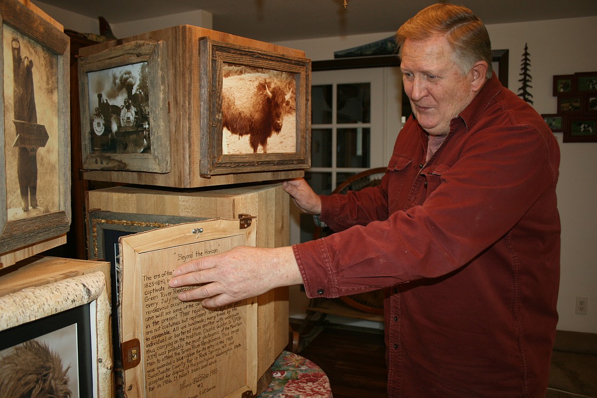 Vinnie O Bannon opens the door to the second layer of his artwork Tuesday.