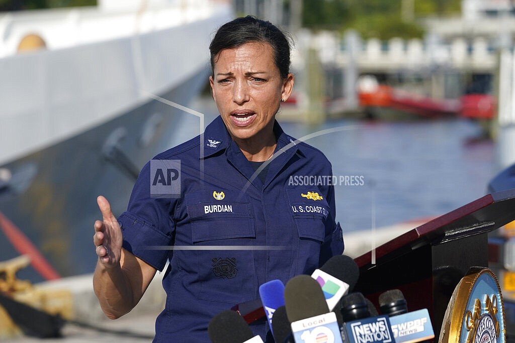 U.S. Coast Guard Captain Jo-Ann F. Burdian details the search of 38 missing migrants at a news conference, Wednesday, Jan. 26, 2022, in Miami Beach, Fla. One migrant was found clinging to the hull of an overturn vessel and one body was recovered off the coast of Fort Pierce, Fla. The migrants left the Bahamas on Saturday in what the Coast Guard suspects is a human smuggling operation. (AP Photo/Marta Lavandier)