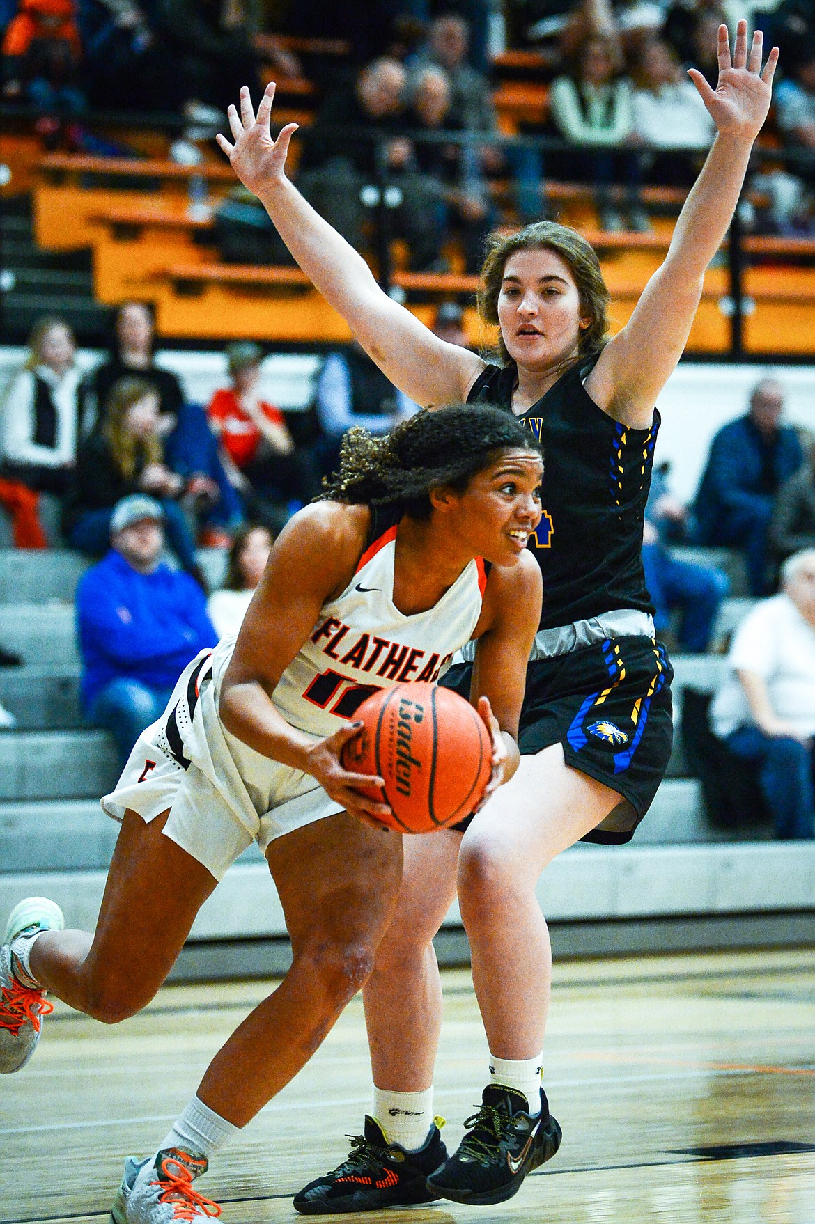 Flathead's Akilah Kubi (12) looks to pass under the basket against Missoula Big Sky at Flathead High School on Thursday, Jan. 27. (Casey Kreider/Daily Inter Lake)